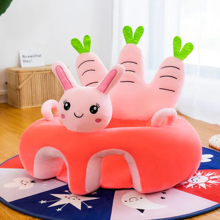 Cute pink plush bunny chair with carrot-shaped backrest on colorful star and moon rug