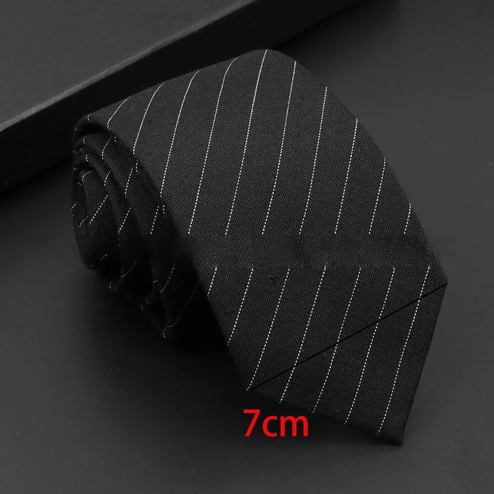 Black pinstripe necktie 7cm wide on black background