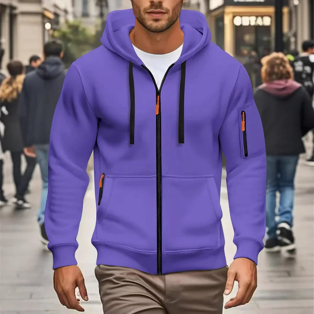 Man wearing purple zip-up hoodie with black drawstrings and orange zipper pulls on urban street