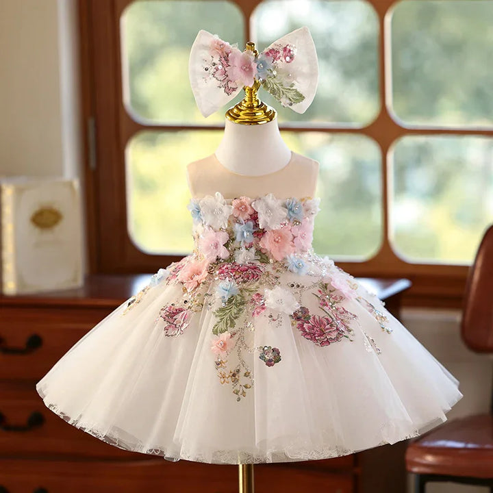 White floral embroidered girl's party dress with pink, blue 3D flowers and matching large bow headband