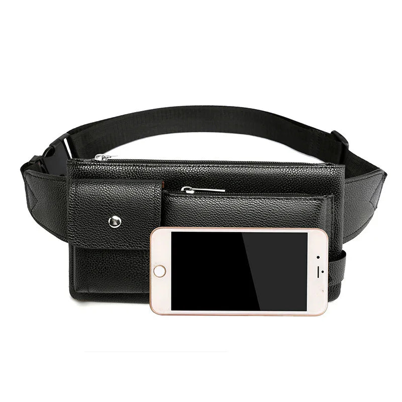 Black leather waist bag with multiple zippered pockets and adjustable strap beside smartphone