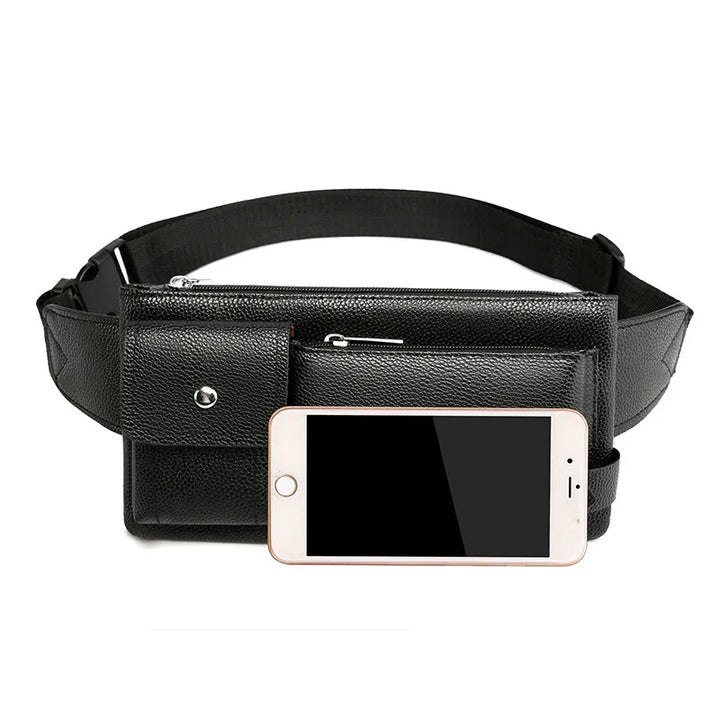 Black leather waist bag with multiple zippered pockets and adjustable strap beside smartphone