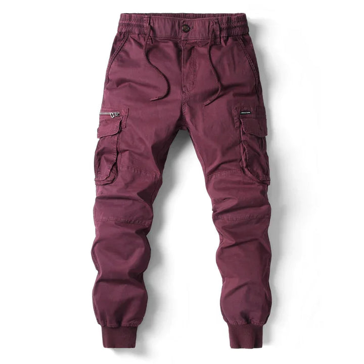 Men's maroon cargo jogger pants with elastic waistband and multiple side pockets