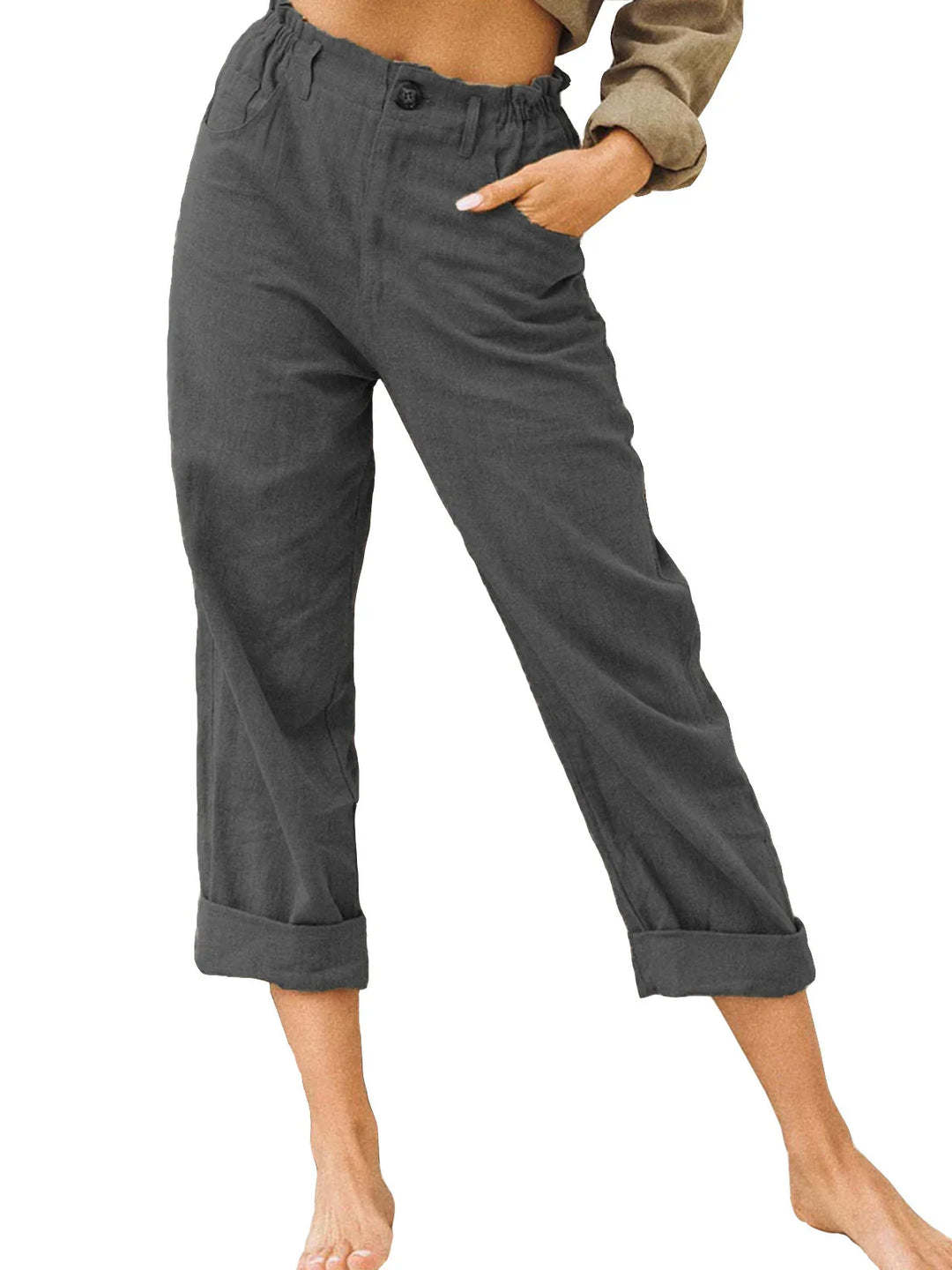 Woman wearing rolled-up charcoal gray casual pants with elastic waistband and button detail