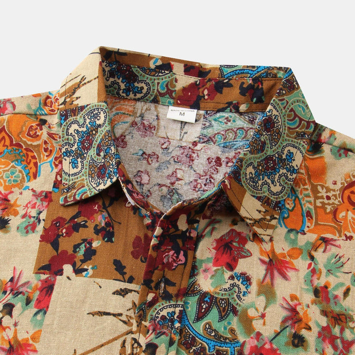 Medium size floral and paisley print shirt with multicolor patterns including orange, red, blue, and beige