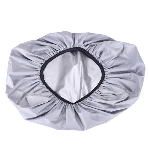 Silver waterproof car tire cover with elastic edge on a white background