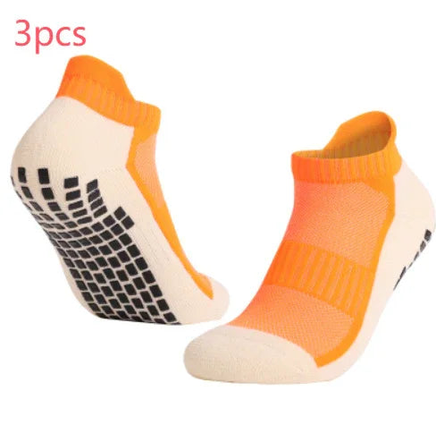 Pair of orange and beige non-slip grip ankle socks with black sole pads, 3pcs
