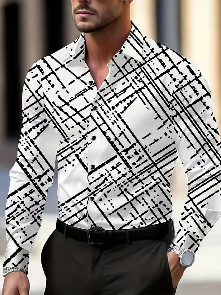 Man wearing white long-sleeve button-up shirt with abstract black linear pattern and black pants