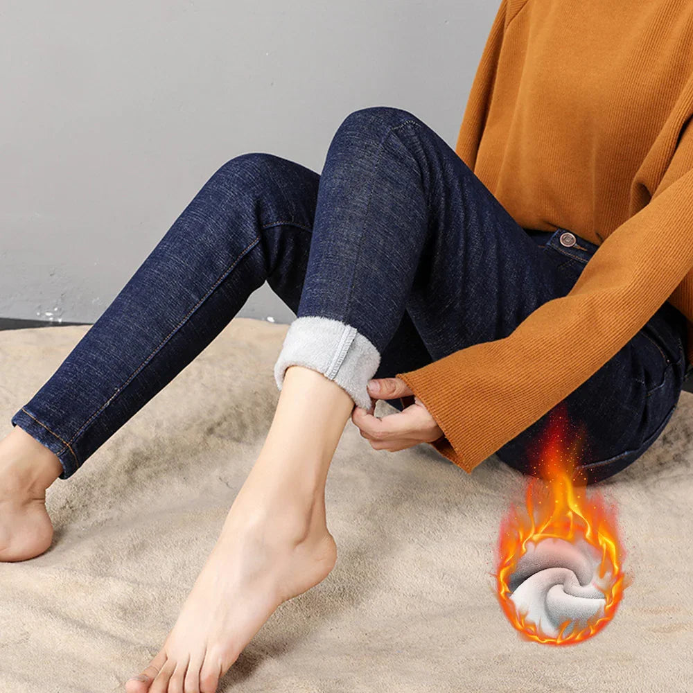 Person wearing blue fleece-lined skinny jeans and orange sweater showing warm fabric detail