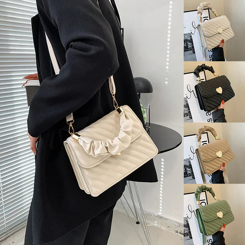 Women carrying stylish quilted crossbody handbag with scrunched top handle in cream, black, beige, and green colors