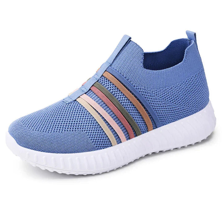Blue knit slip-on sneaker with multicolor stripes and white textured sole