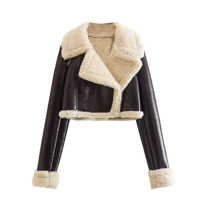 Cropped dark brown leather jacket with beige shearling lining on collar, cuffs, and hem