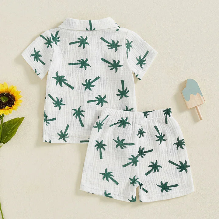 White kids summer pajama set with green palm tree print, short sleeves and shorts