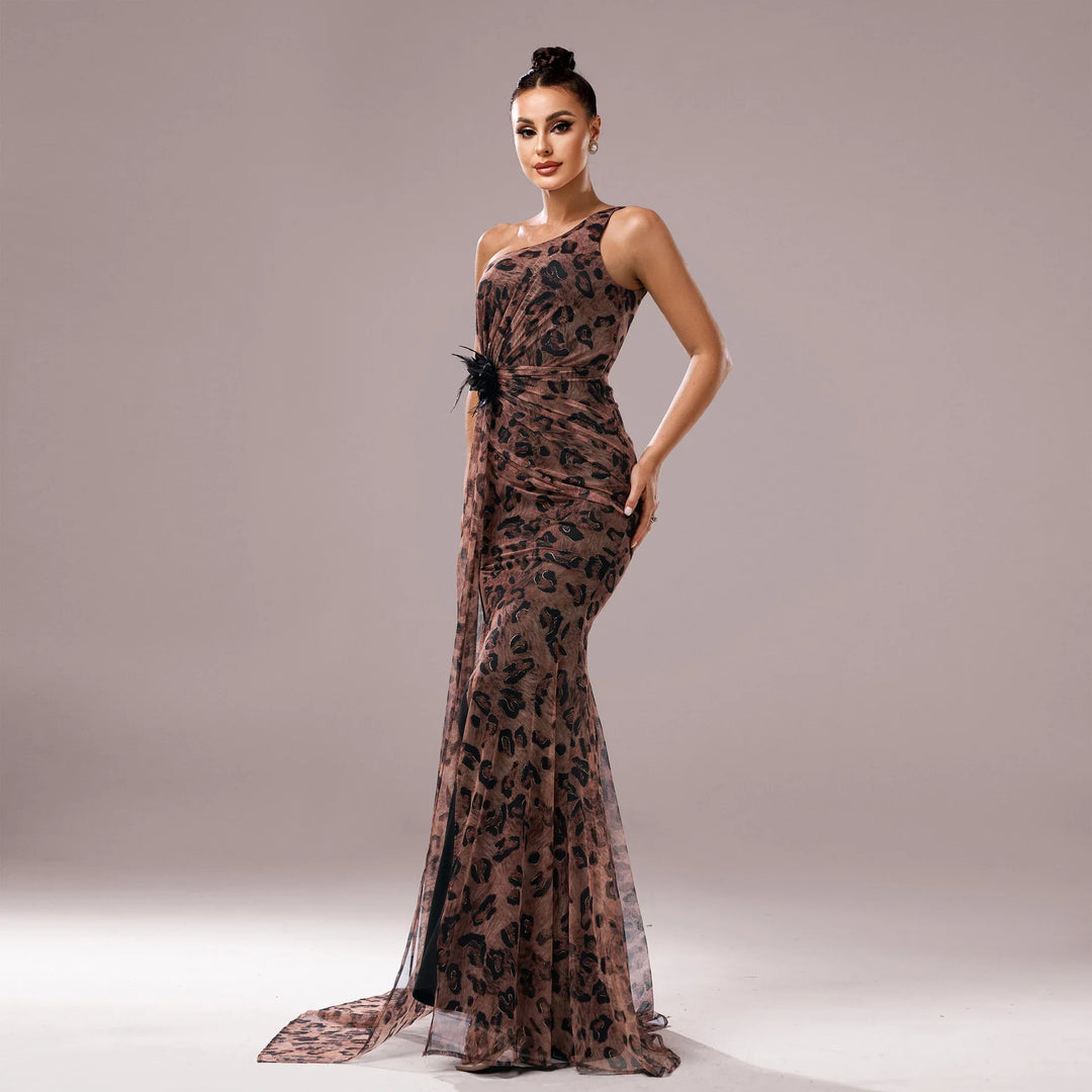 Elegant woman in a brown leopard print one-shoulder evening gown with black feather detail