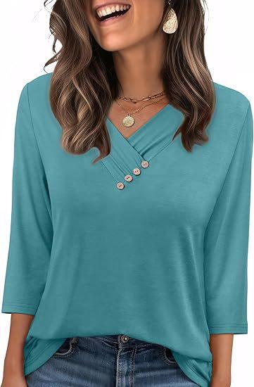 woman wearing teal V-neck top with buttons and 3/4 sleeves paired with blue jeans