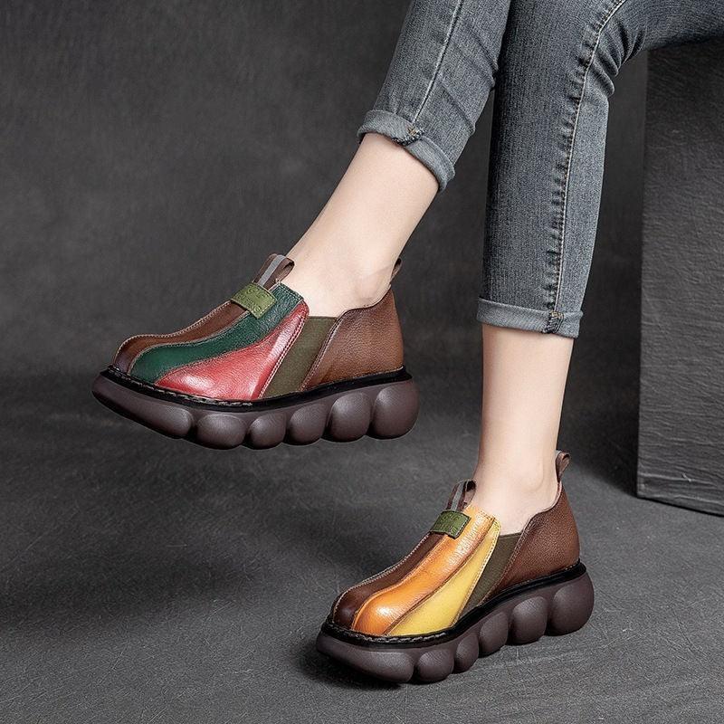 Stylish casual leather platform shoes with colorful panels and chunky bubble soles worn with rolled-up jeans
