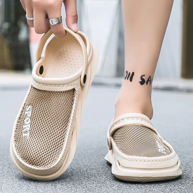 Beige mesh slip-on summer sandals with adjustable strap worn on feet on street