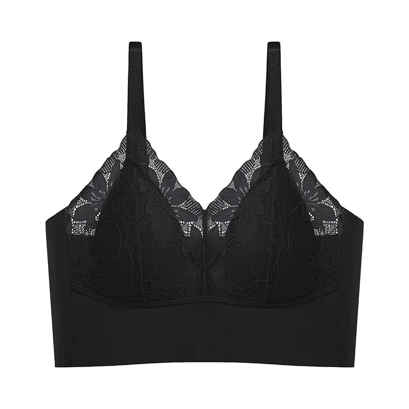 Black lace bralette with floral mesh design and adjustable straps on white background