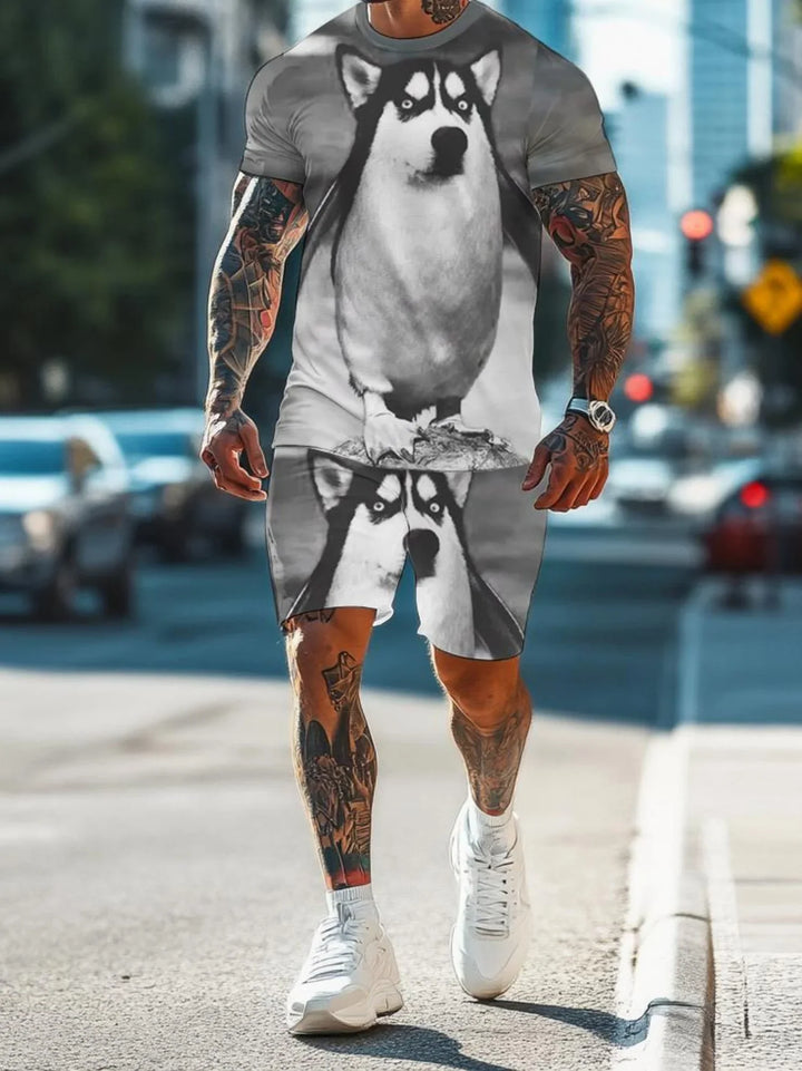 Man wearing matching gray t-shirt and shorts with large husky dog print, walking on city street