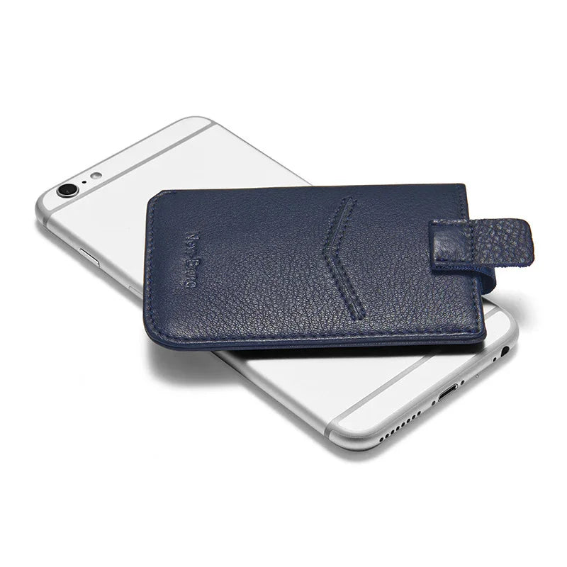 Navy blue leather phone case with magnetic strap on silver smartphone on white background