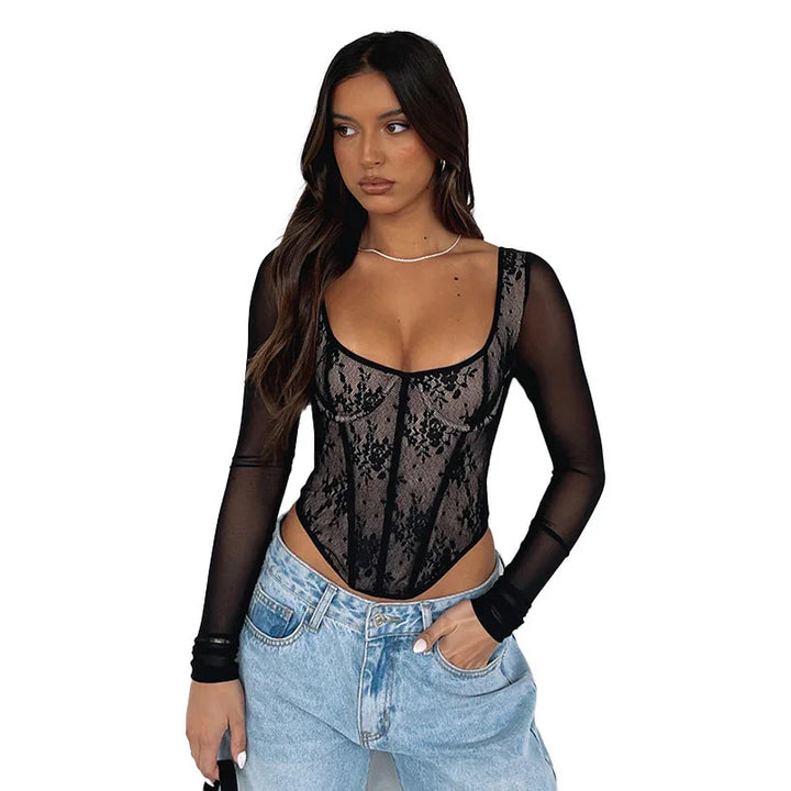 Woman wearing black lace sheer mesh long-sleeve bodysuit with light blue jeans