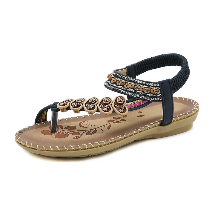 Black and tan beaded women's sandal with floral designs and ankle strap