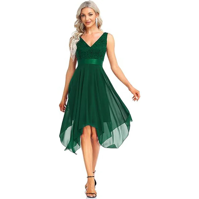 Woman wearing sleeveless dark green asymmetrical hem dress with lace bodice and satin waist