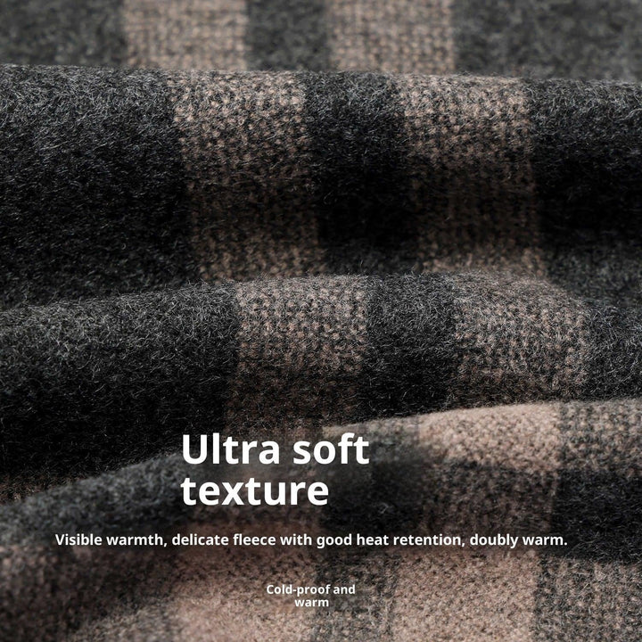 Close-up of ultra soft brown and black plaid fleece fabric with warm texture