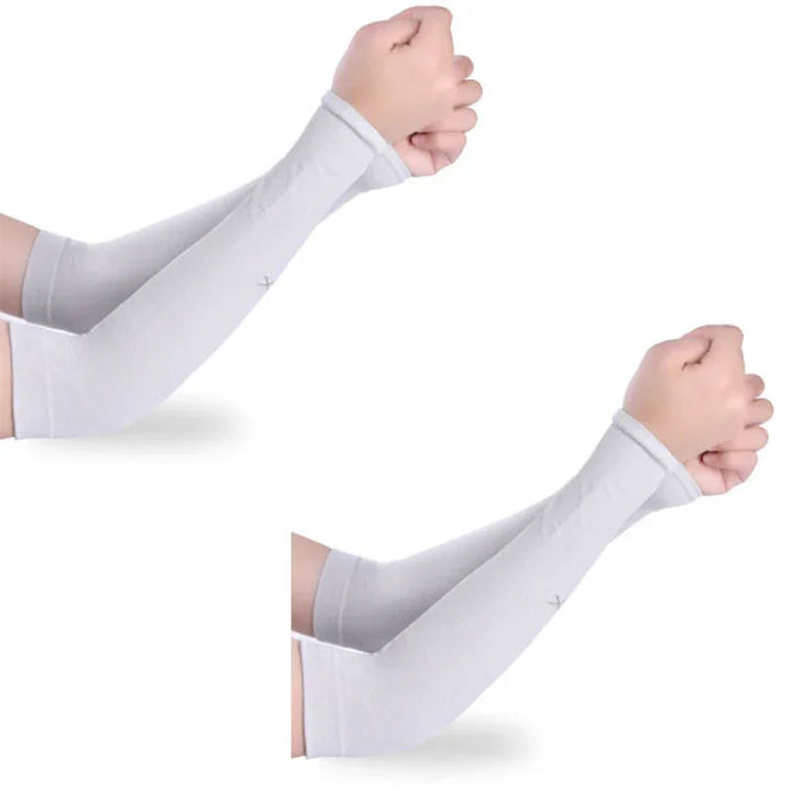 Pair of light gray arm sleeves worn on forearms with hands clenched on white background