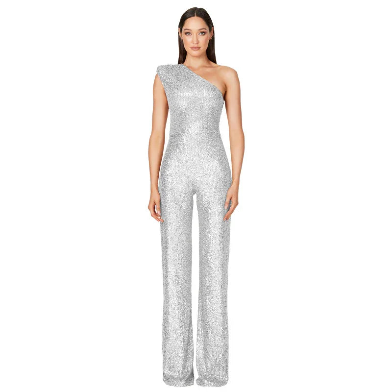 Woman wearing silver sequined one-shoulder jumpsuit with wide-leg pants on white background