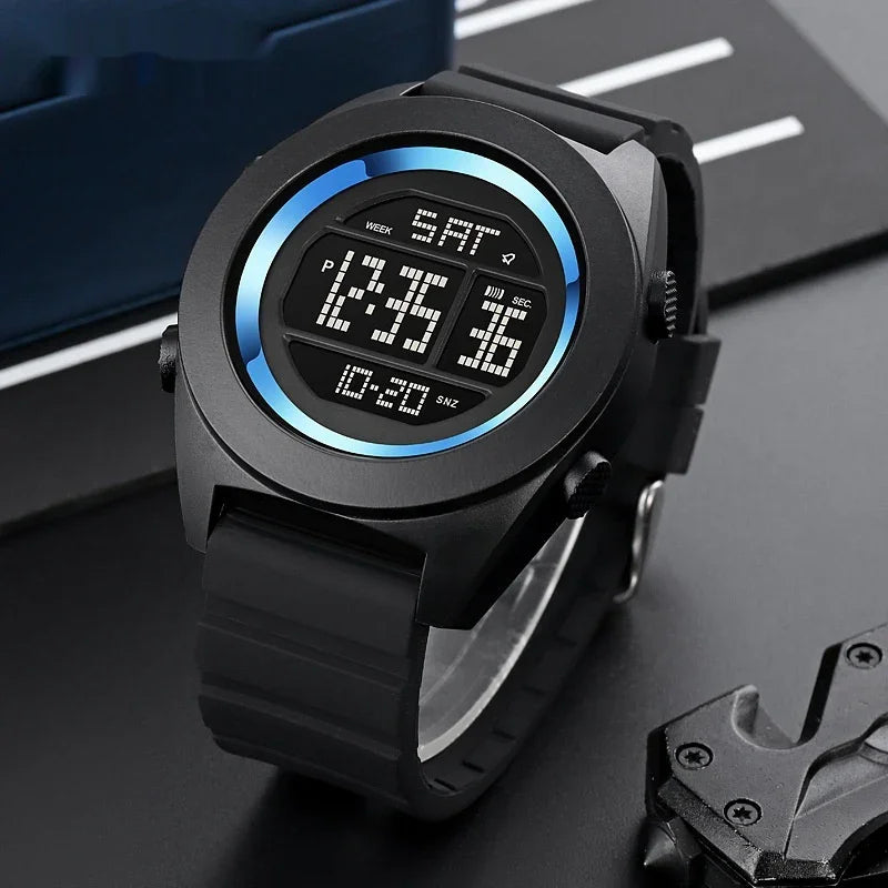 Black digital wristwatch with blue gradient ring and rubber strap showing time, date, and seconds on display