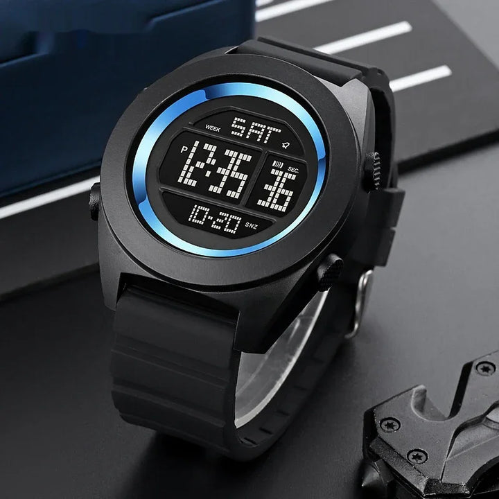 Black digital wristwatch with blue gradient ring and rubber strap showing time, date, and seconds on display