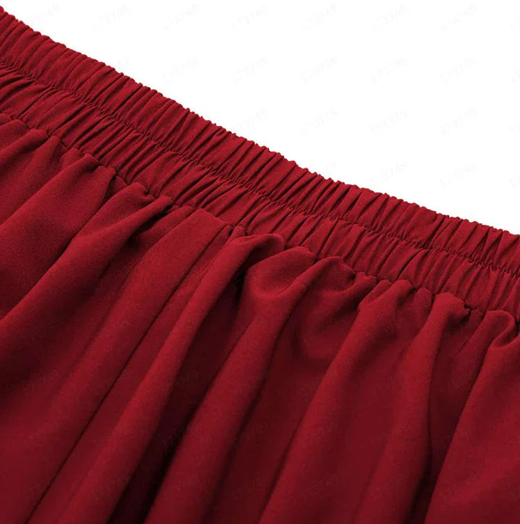 Close-up of a red elastic waistband on gathered fabric, showcasing texture and stretch fit