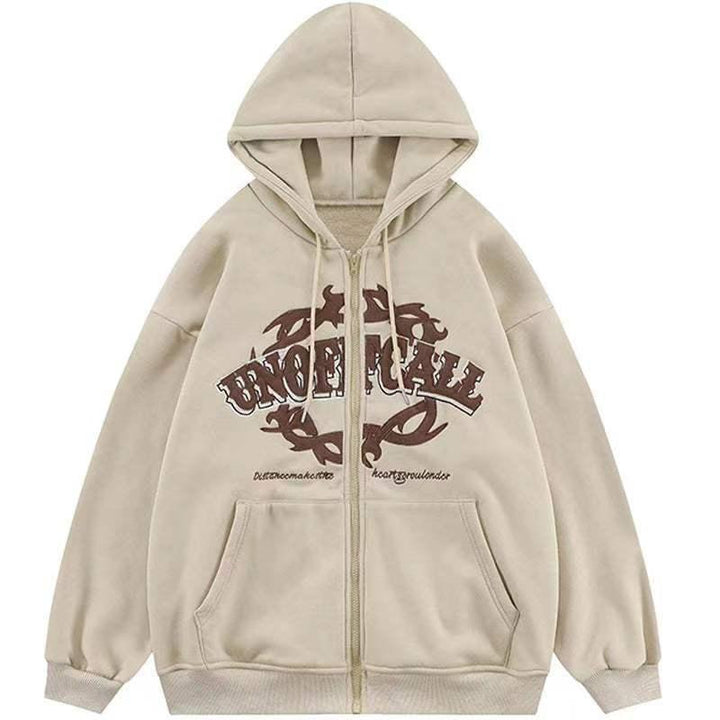 Beige zip-up hoodie with brown tribal design and text, front pockets, and drawstring hood