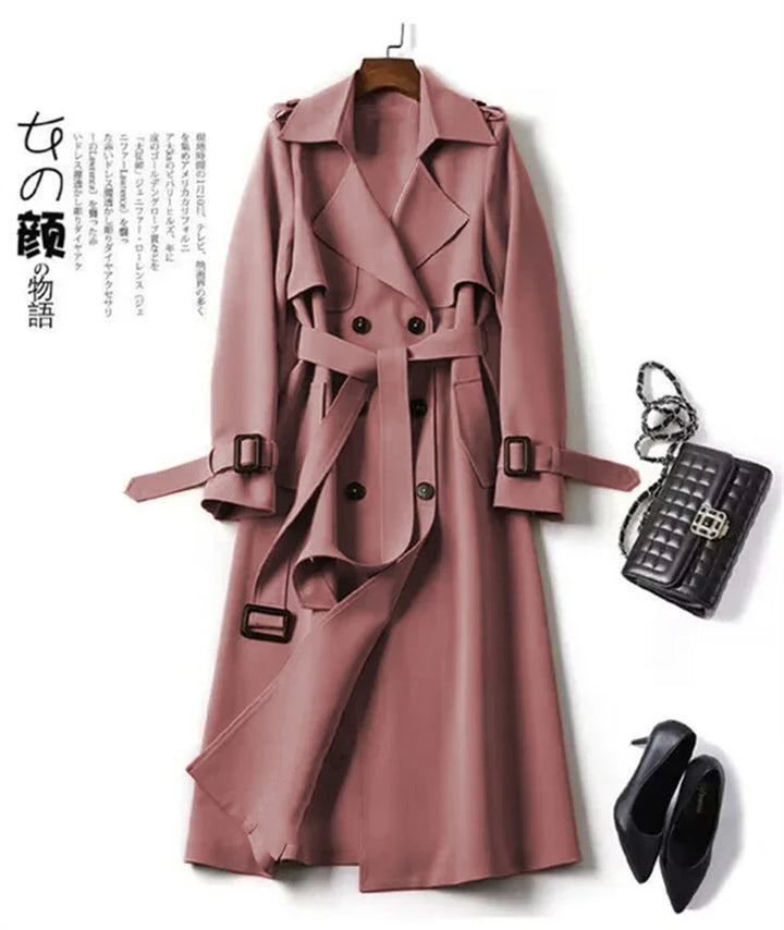 Mauve double-breasted trench coat with belt, paired with black quilted handbag and black pointed heels