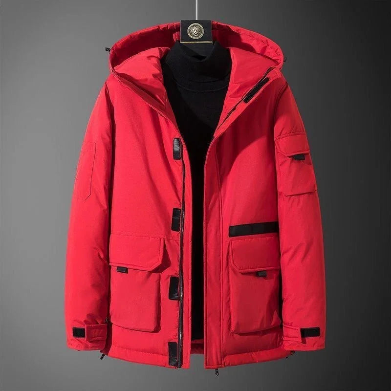 Red winter parka jacket with hood and black accents, displayed on hanger against gray background