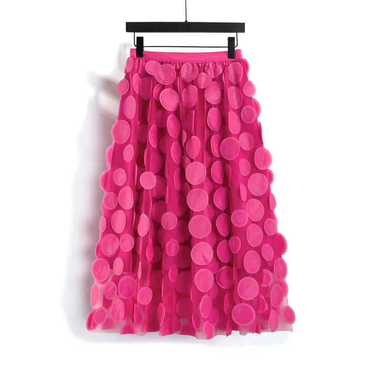 Bright pink midi skirt with 3D circular appliques hanging on black hanger