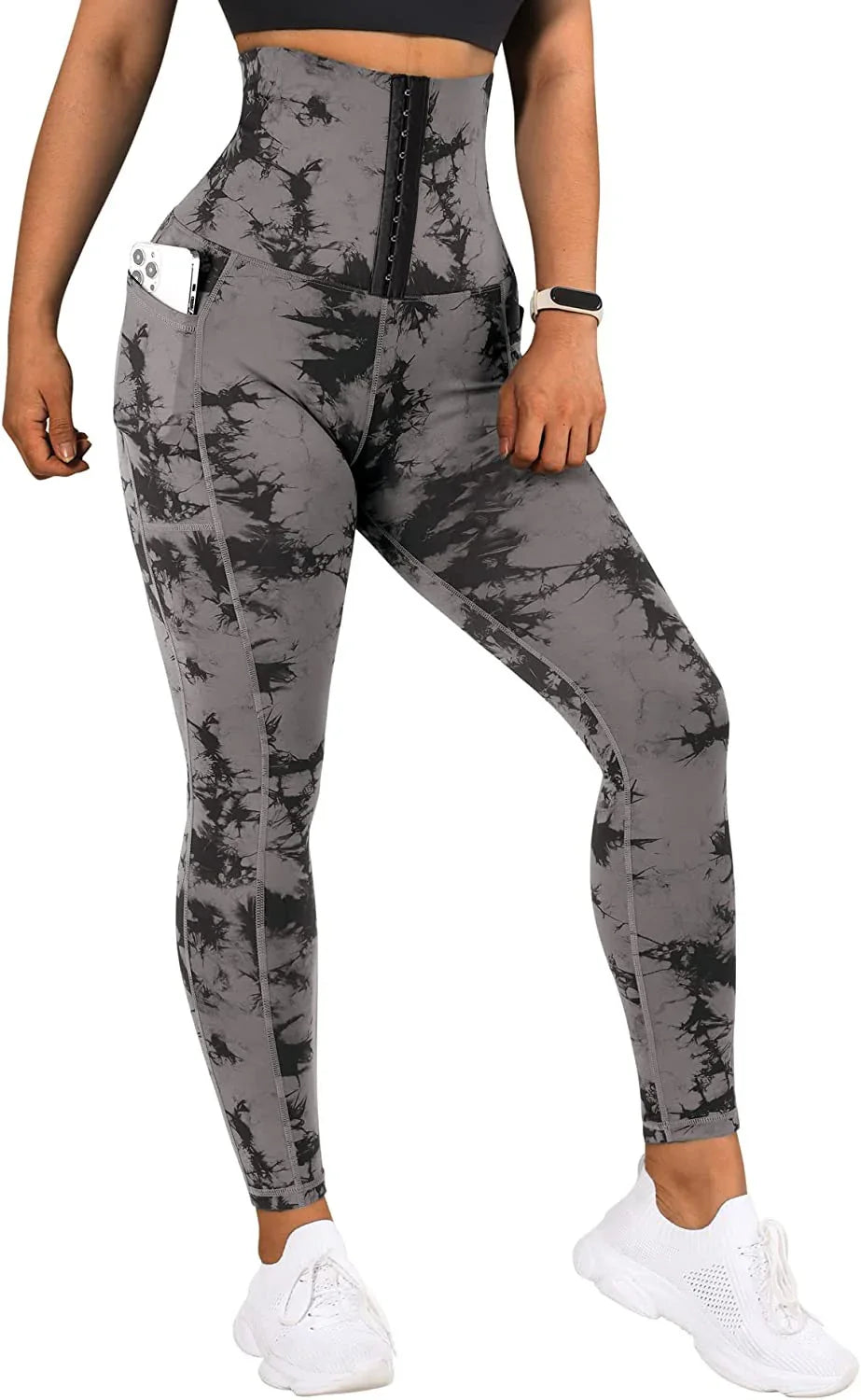 Woman wearing gray and black tie-dye high-waist workout leggings with phone pocket and waist trainer
