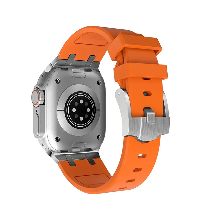 Smartwatch back view with silver casing and bright orange silicone strap featuring buckle closure