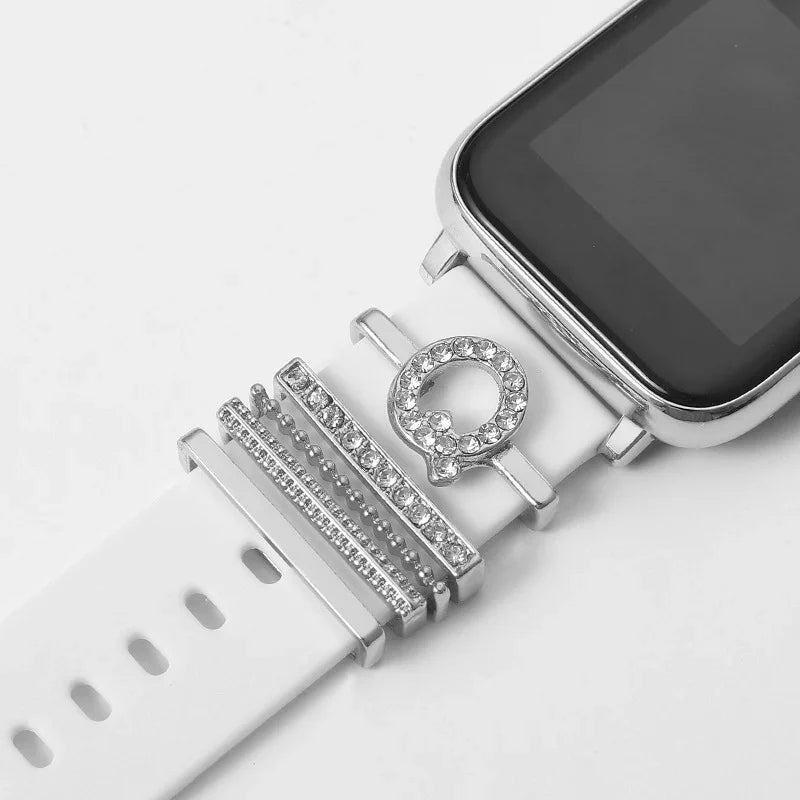 Smartwatch with white band decorated with silver and rhinestone charm accessories