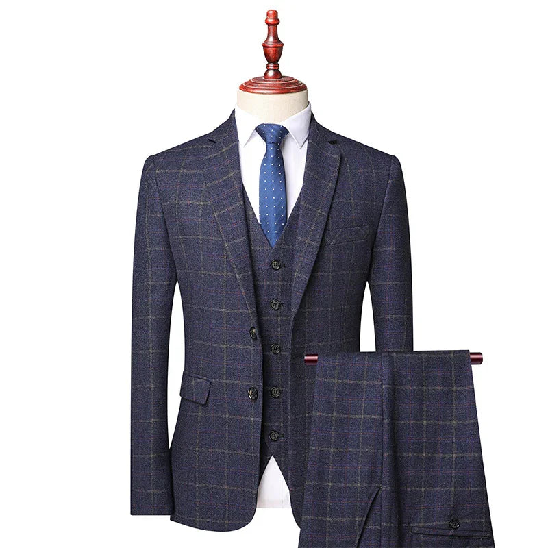 Men's navy blue plaid three-piece suit with white dress shirt and blue polka dot tie on mannequin