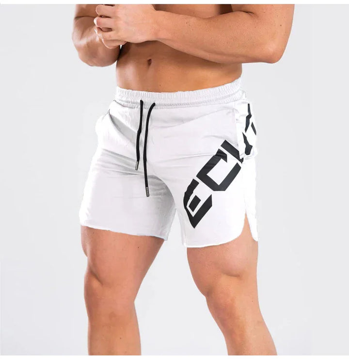White athletic shorts with black drawstring and bold black graphic on a muscular male model