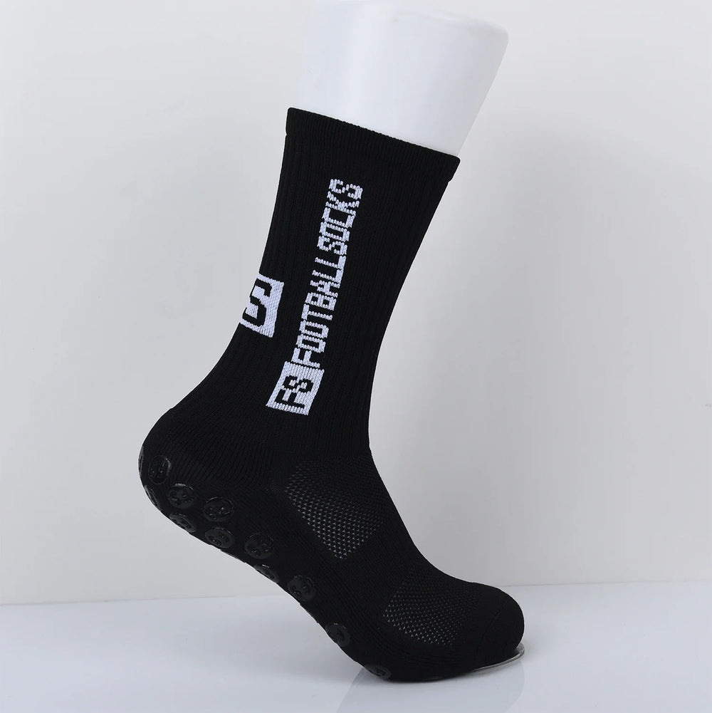 Black anti-slip grip sock with white B Motivation text on a white mannequin foot
