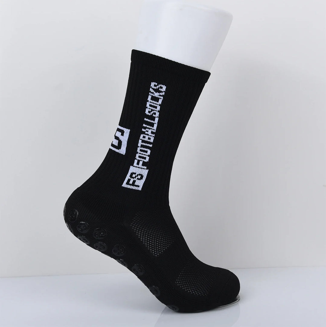 Black anti-slip grip sock with white B Motivation text on a white mannequin foot