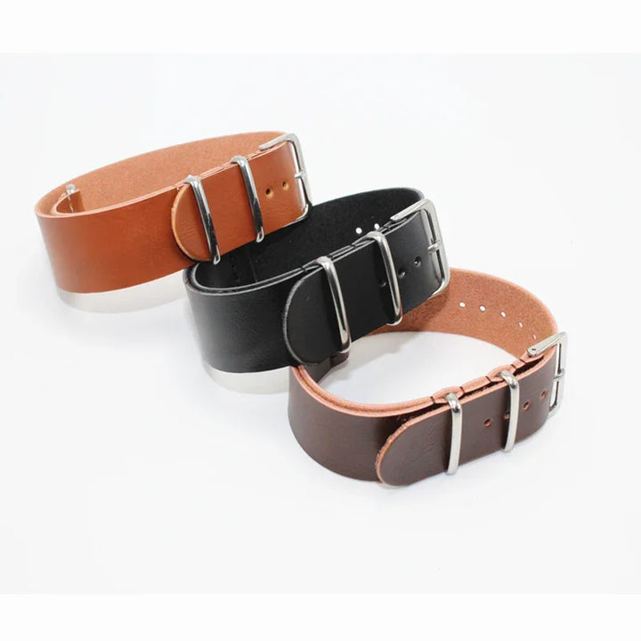 Three leather watch straps in tan, black, and brown with silver buckles on white background