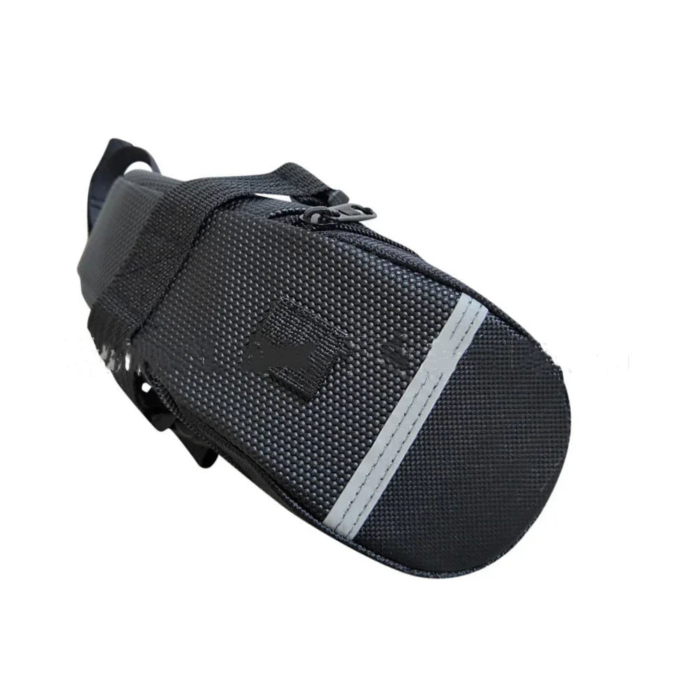 Black textured bike saddle bag with zipper, strap, and reflective strip on white background
