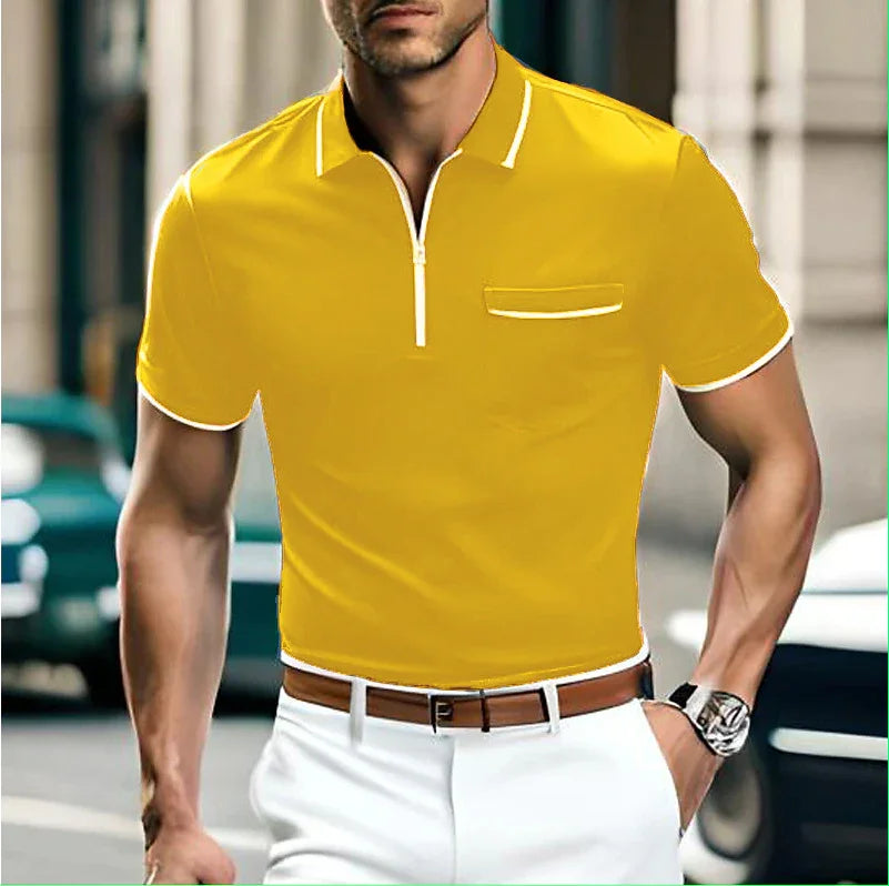 Man wearing yellow short-sleeve polo shirt with white trim and white pants in urban setting