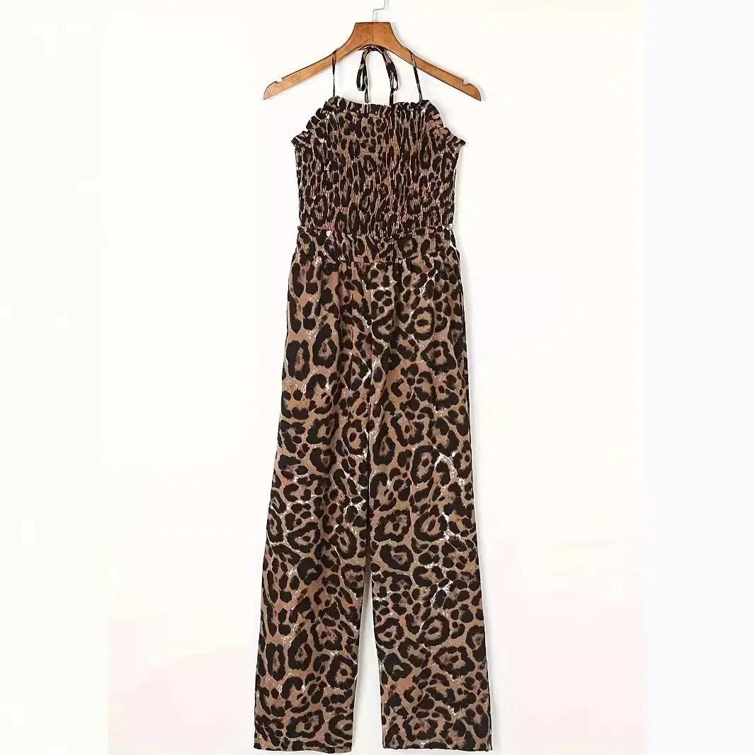 leopard print sleeveless halter jumpsuit with smocked bodice on wooden hanger
