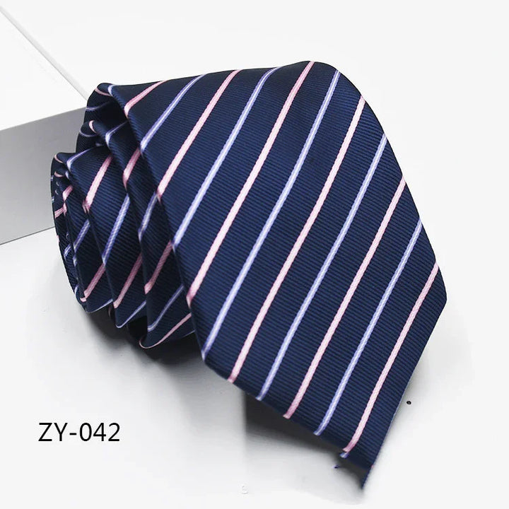 Navy blue men's necktie with diagonal pink and light blue stripes, folded on a white surface
