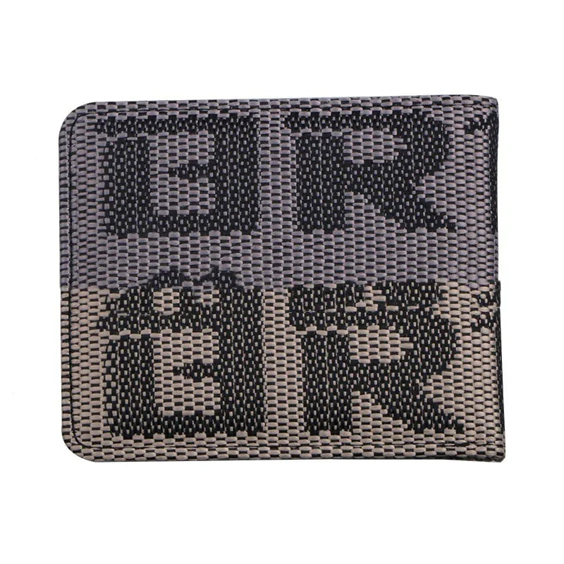 Black and gray woven fabric wallet with large stylized letters pattern